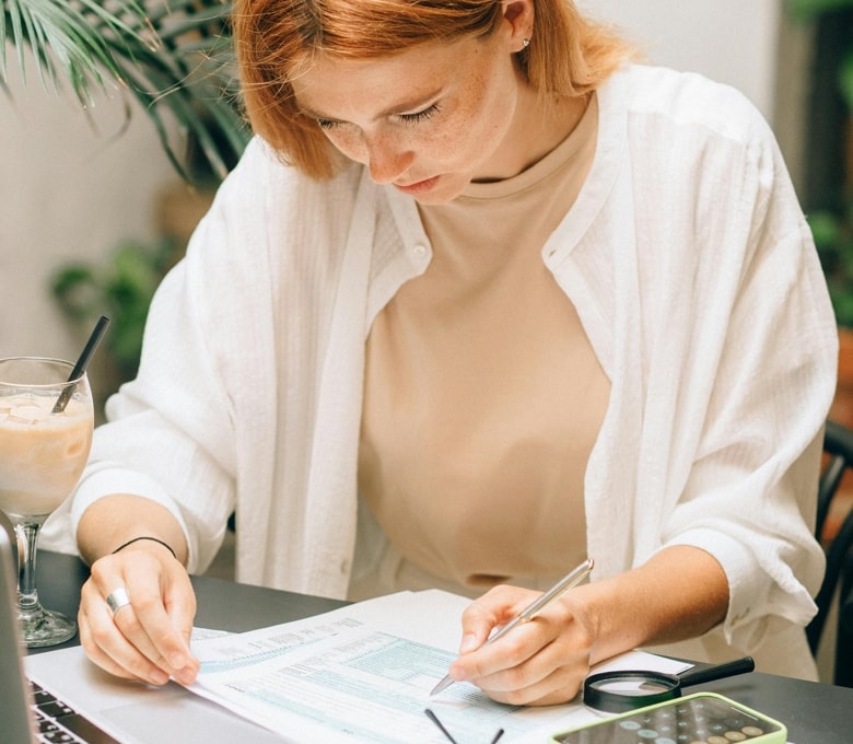 Lady reading debt settlement letter